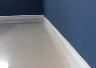 Blue wall with clean white skirting, Dubai painting