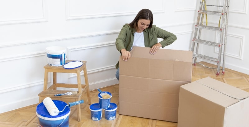 Stress-Free Move Out Painting Services in Dubai Woman preparing for move-out painting in Dubai